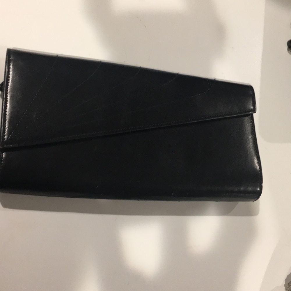 Arman exchage leather clutch